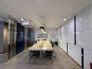Modern office interior with a long conference table, comfortable chairs, and artistic wall decorations