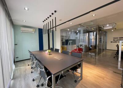 Modern office space with meeting area and glass partitions