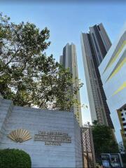 Exterior view of The Residences at Mandarin Oriental Bangkok against a clear sky