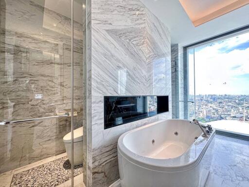 Luxurious marble bathroom with city view