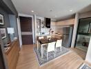 Modern open-plan kitchen and dining area with wooden flooring