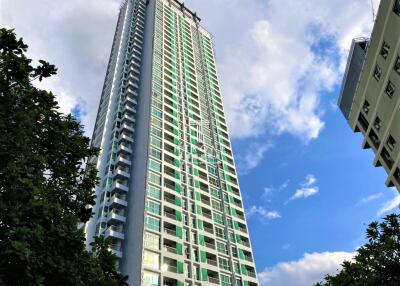 High-rise residential building under clear blue sky