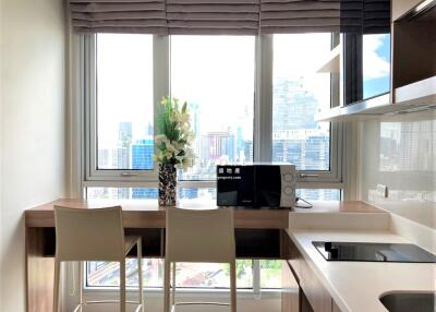Modern kitchen with city view and breakfast bar