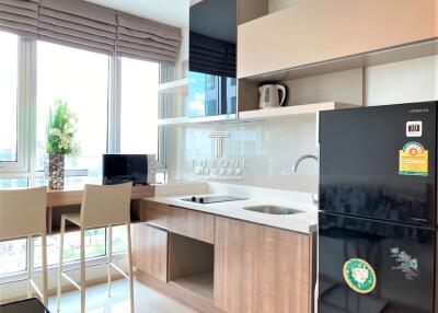 Modern kitchen with wooden finish cabinets and state-of-the-art appliances