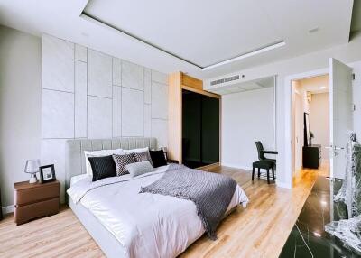 Modern bedroom with large bed and en-suite bathroom