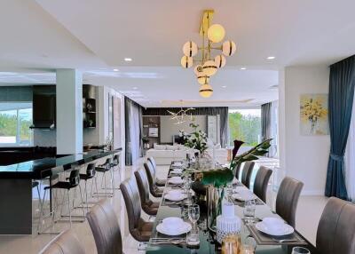 Elegant dining and living area with modern lighting and stylish decor