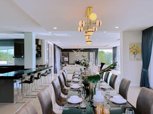 Elegant dining and living area with modern lighting and stylish decor