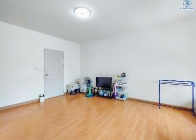 Spacious and brightly lit empty living room with laminate flooring