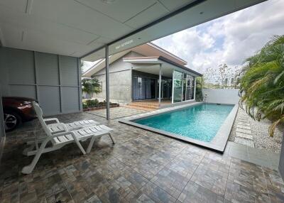 Modern home outdoor area with swimming pool and patio