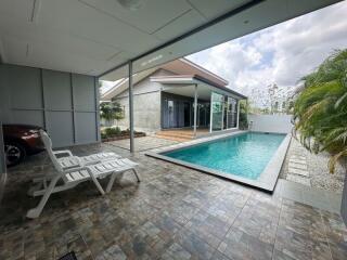 Modern home outdoor area with swimming pool and patio
