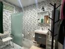 Modern bathroom with patterned wallpaper and stylish fixtures