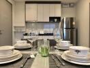 Modern kitchen with dining setup and stainless steel appliances