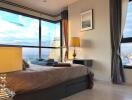 Elegant bedroom with modern decor and cityscape view