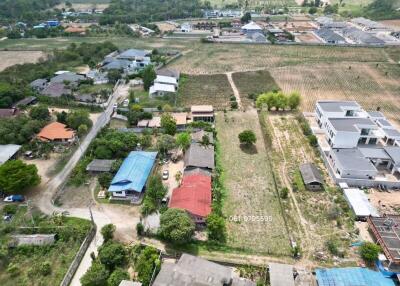 Aerial view of a residential area with potential vacant land for property development