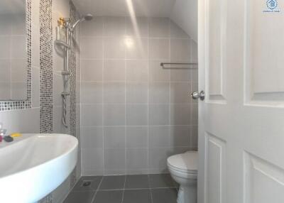 Modern bathroom with shower and ceramic tiles