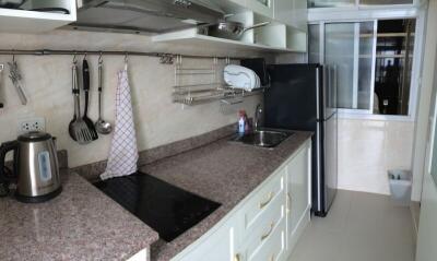 Modern kitchen with stainless steel appliances and granite countertop