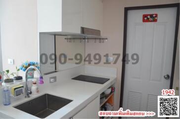 Modern kitchen with stainless steel sink and ample counter space