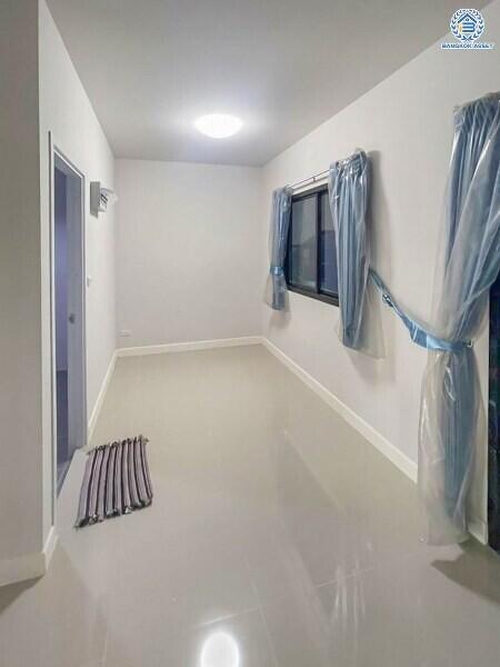 Bright corridor with glossy tiled flooring and wrapped window fixtures