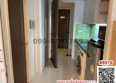 Compact kitchen area with modern appliances and green tile backsplash