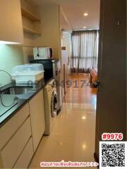 Modern kitchen with glossy flooring and integrated appliances