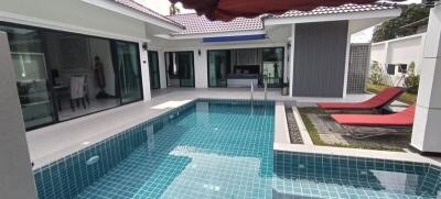 Private Swimming Pool with Sun Loungers and Adjacent Living Space