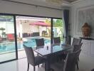 Elegant dining room with view of the pool area