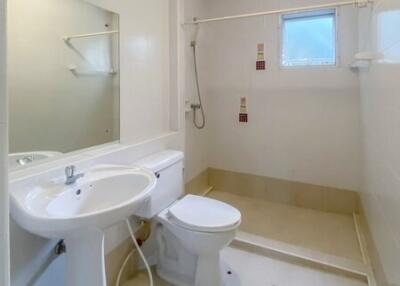 Bright, clean bathroom interior with white fixtures