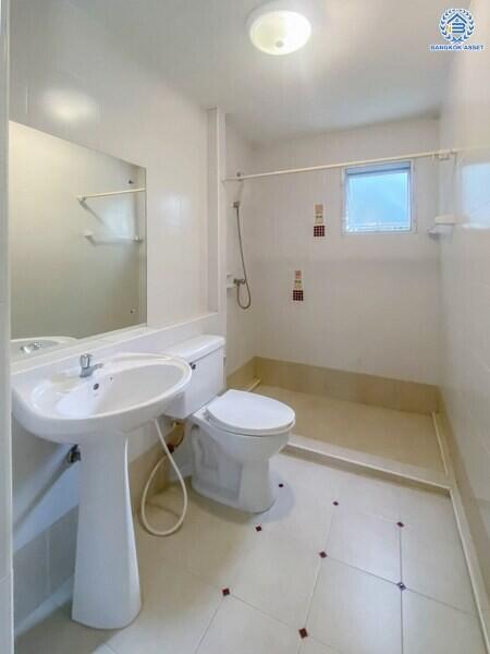 Bright, clean bathroom interior with white fixtures