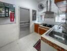 Modern kitchen with stainless steel appliances and tile backsplash