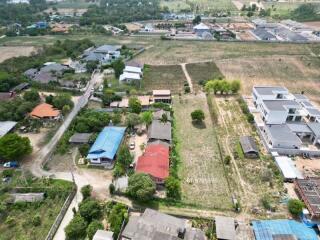 Aerial view of a residential area with potential land for development