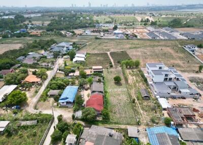 Aerial view of residential area with a variety of buildings and plots