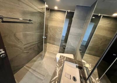 Modern bathroom with glass shower and marble finish