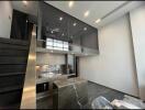 Spacious living room with high ceiling and modern staircase