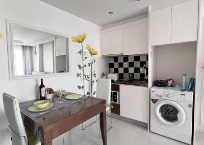 Modern kitchen with dining area and appliances