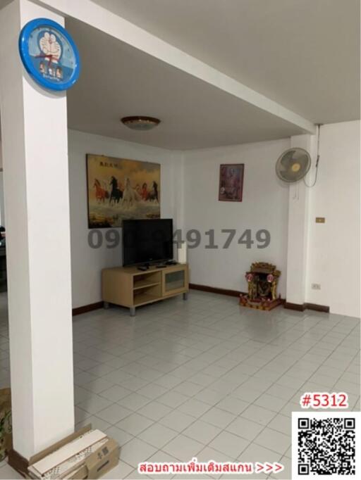 Spacious living room with tiled flooring and modern amenities
