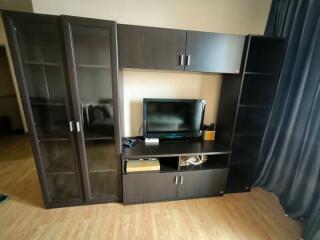 Modern living room with entertainment unit and laminate flooring