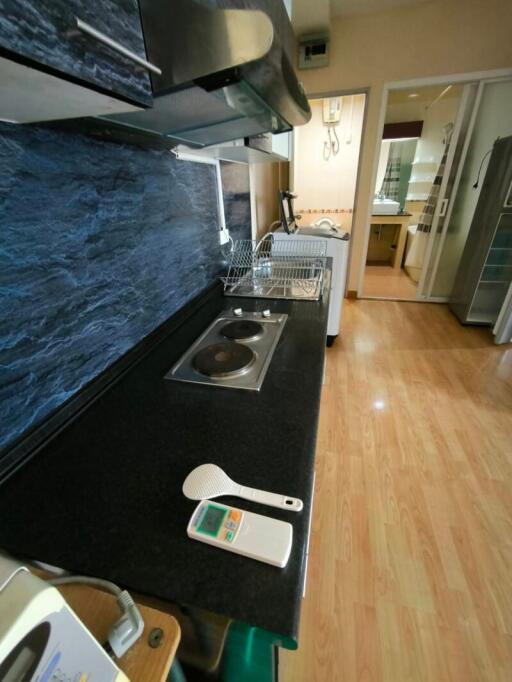 Modern kitchen with stainless steel appliances and black countertop