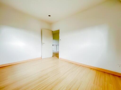 Empty bedroom with wooden flooring