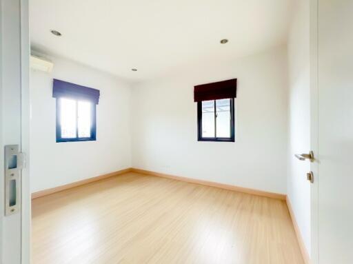 Bright and Empty Bedroom with Wooden Floor