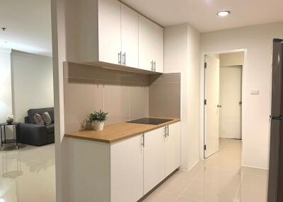 Modern kitchen interior with white cabinetry and sleek countertops