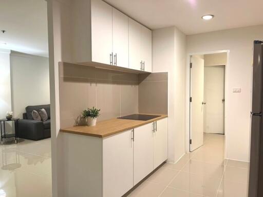 Modern kitchen interior with white cabinetry and sleek countertops