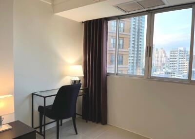 Cozy bedroom with a city view and minimalist decor