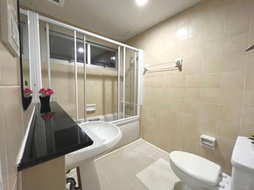 Spacious bathroom with modern fixtures and ample lighting