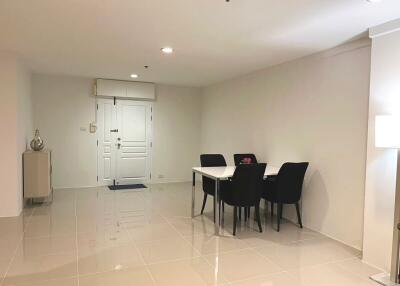 Modern dining area with table, chairs, and sleek tile flooring