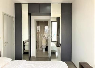 Modern bedroom with built-in closets and en-suite bathroom