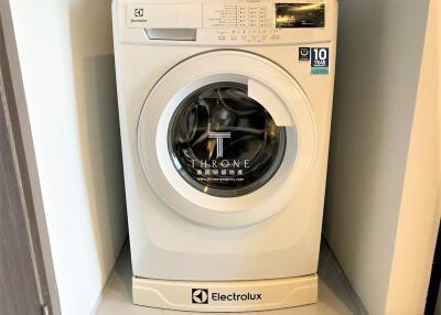 Front loading Electrolux washing machine in a home laundry area