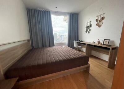 Spacious bedroom with city view and ample natural light