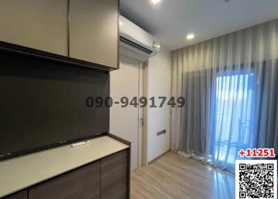 Contemporary bedroom with wooden furniture and large window