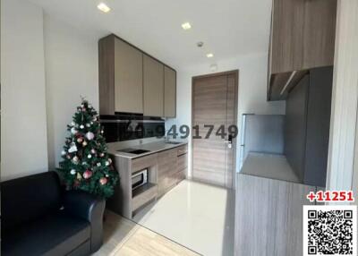 Modern living room with Christmas tree and integrated kitchen