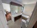 Modern bathroom with dual vanity and large bathtub